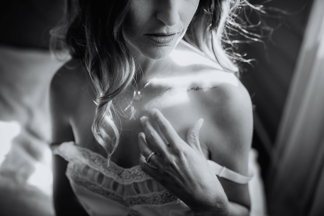 A timeless and sexy image of a long haired beauty by Tampa boudoir photographer - Tami Keehn.